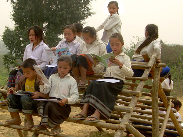 Lao kids reading their first books